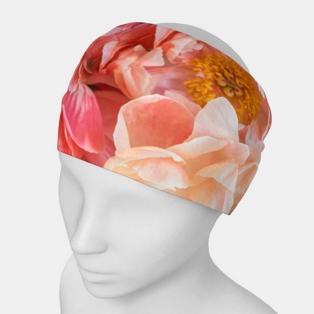 Designer floral stretch headband shown on white mannequin; peach peony flowers are shown.