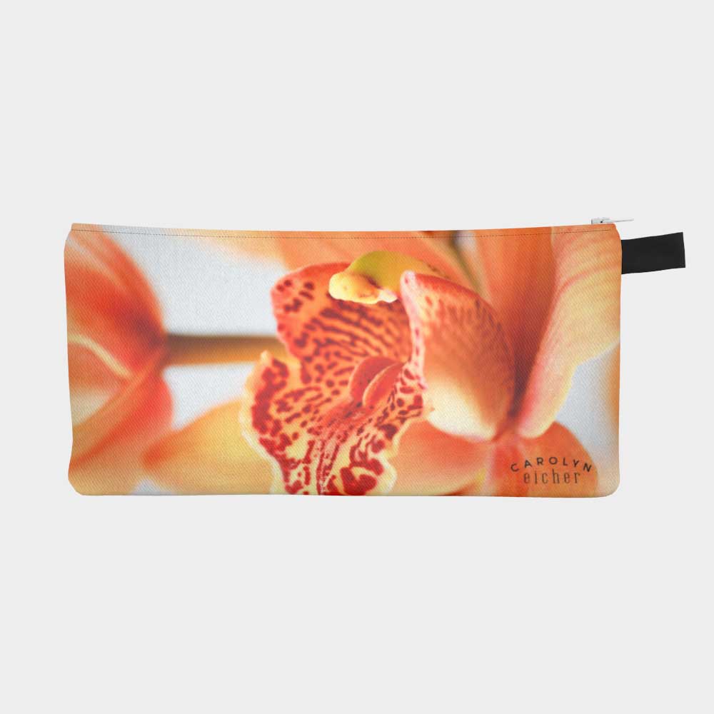 Zippered pouch with close-up of vibrant orange orchid flower, front view
