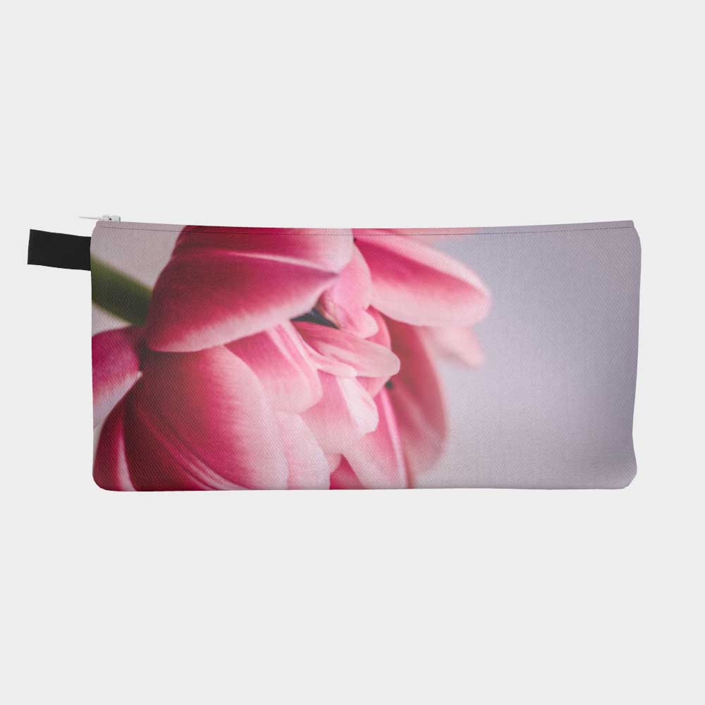 Zippered pouch with close-up image of vibrant pink tulip flower, back view
