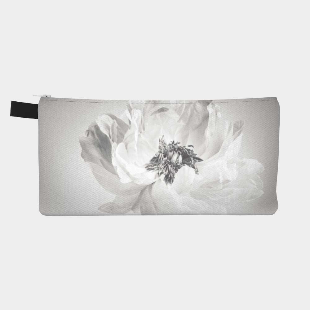 Close-up of zippered pouch showing a peony flower in black and white.