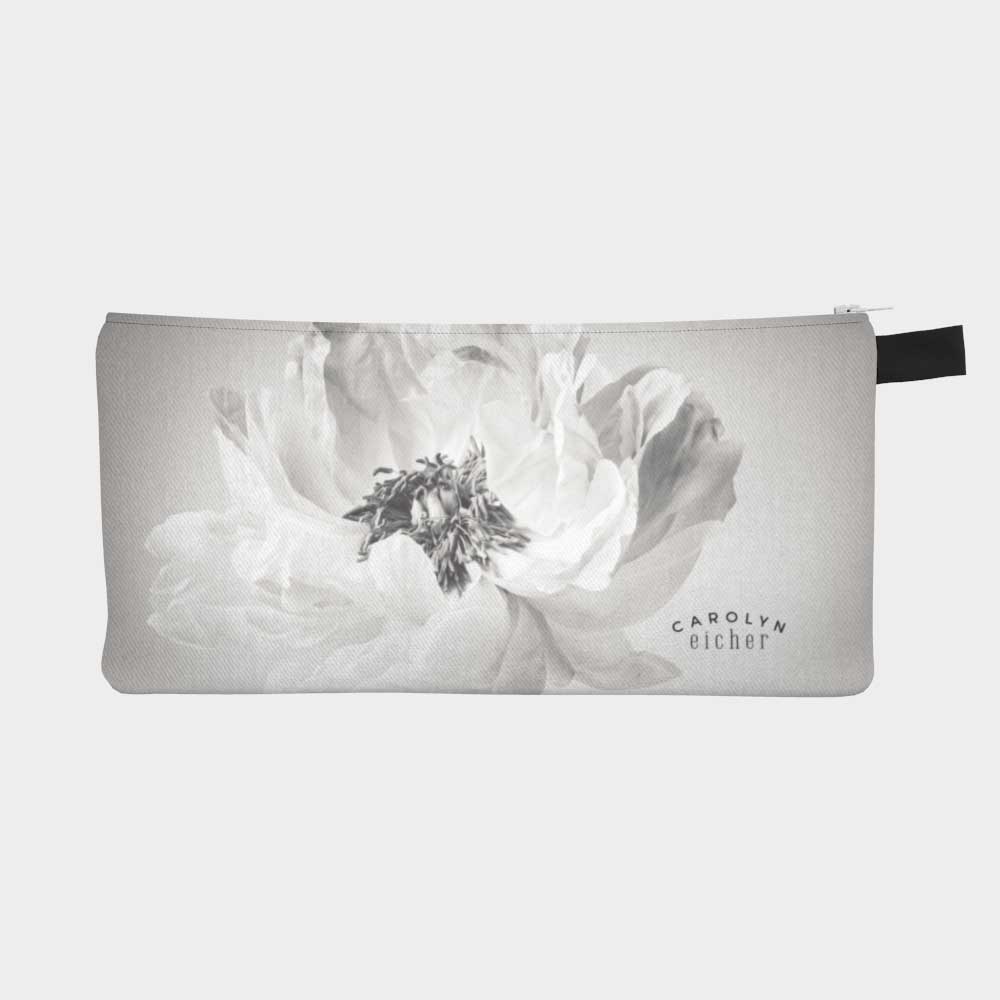 Close-up of zippered pouch showing a black and white image of a peony flower.