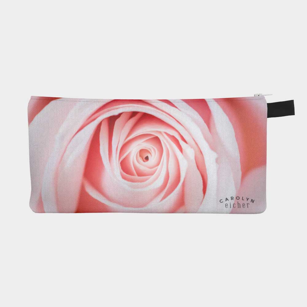 Close-up of zippered pouch with a soft pink rose.