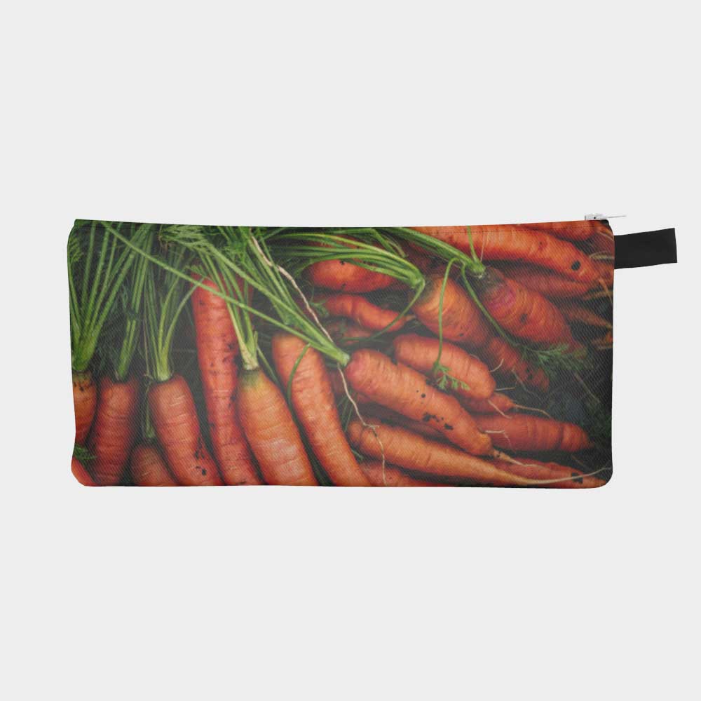 Close-up of zippered pouch with farmers' market carrots.