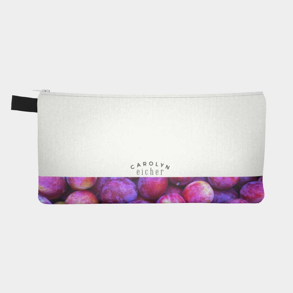 Back of zippered pouch with lower part showing plums from the farmers' market.