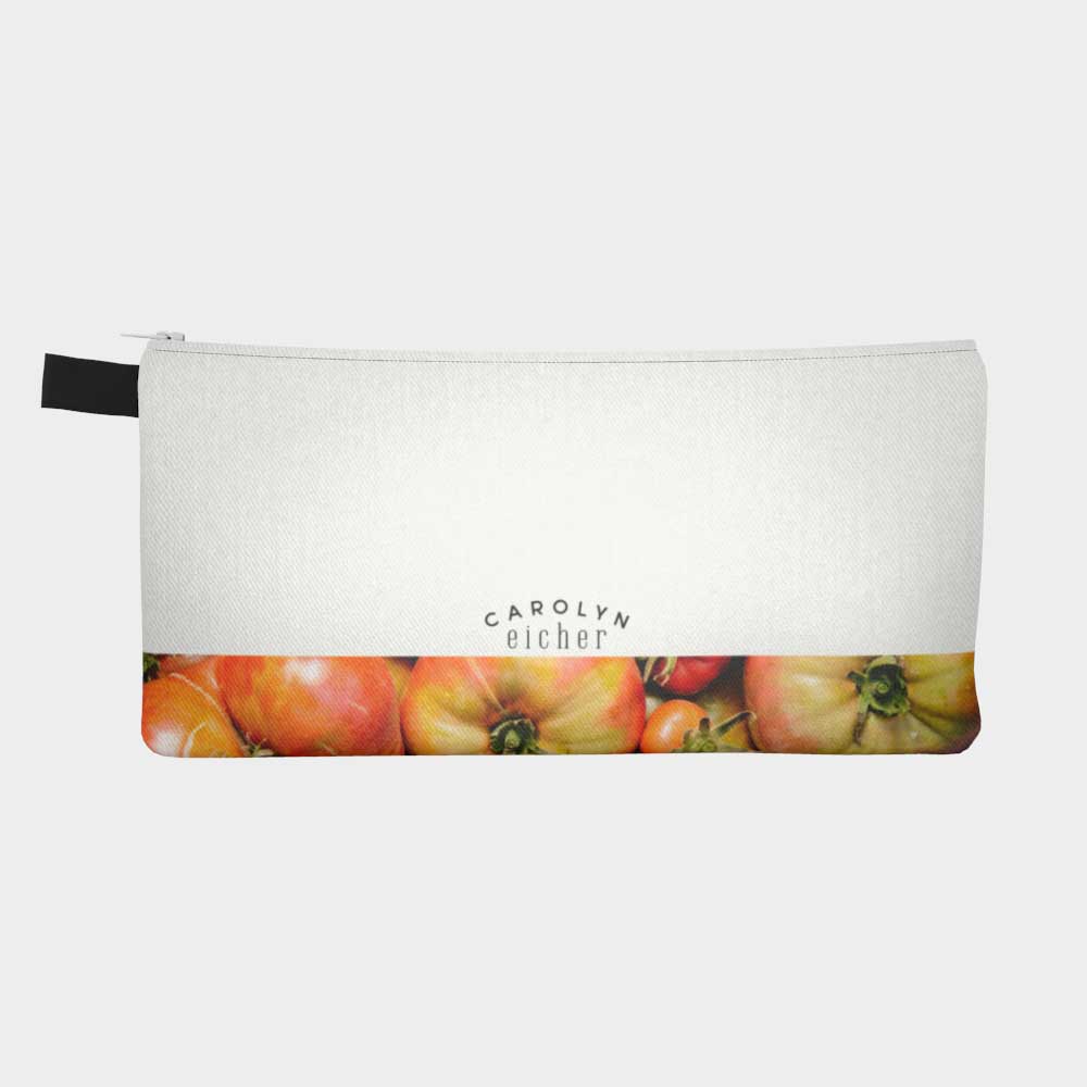 Back of zippered pouch with lower part showing tomatoes from the farmers' market.