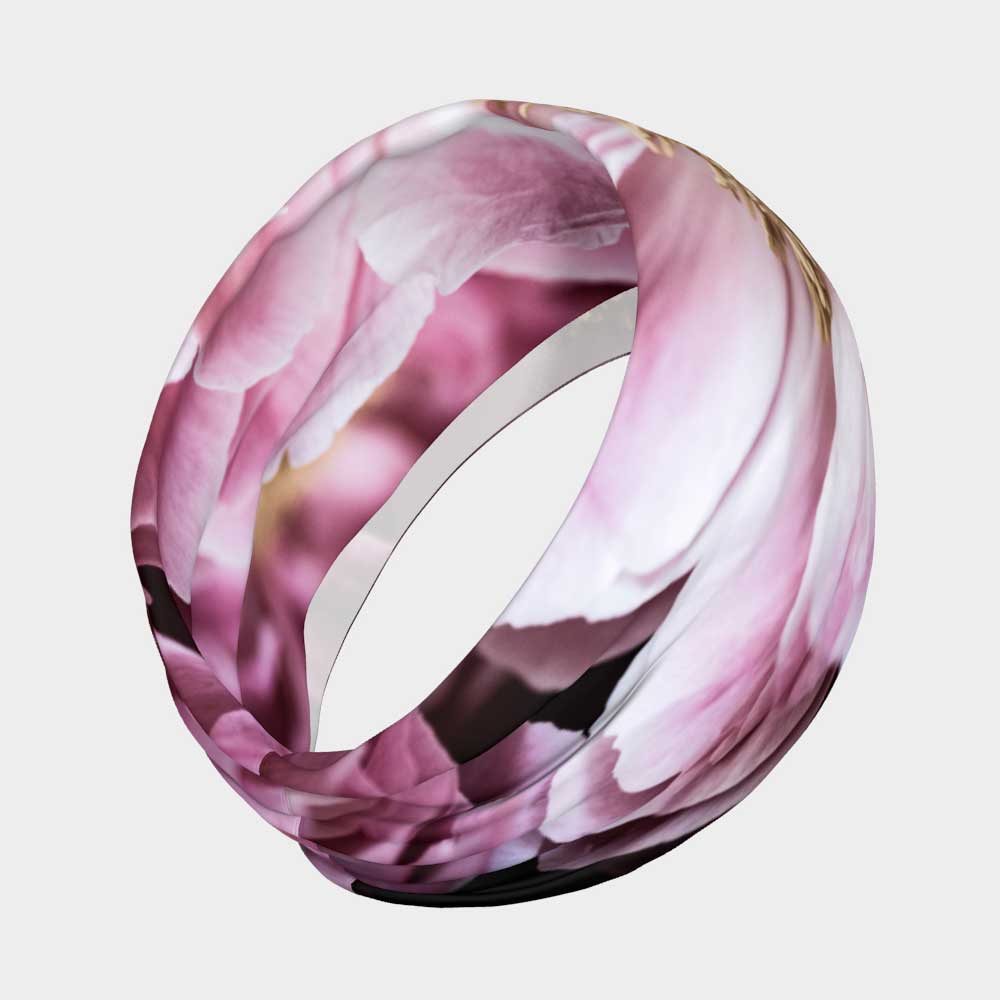 Floral stretch headband of a magenta peony flower shown from the back view.