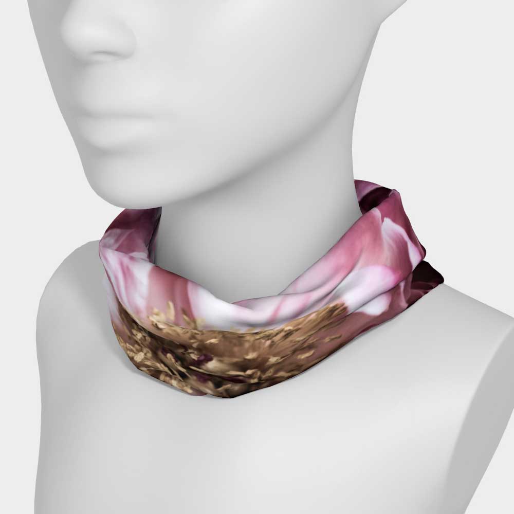 Floral magenta stretch headband worn as a neck scarf shown on white mannequin.